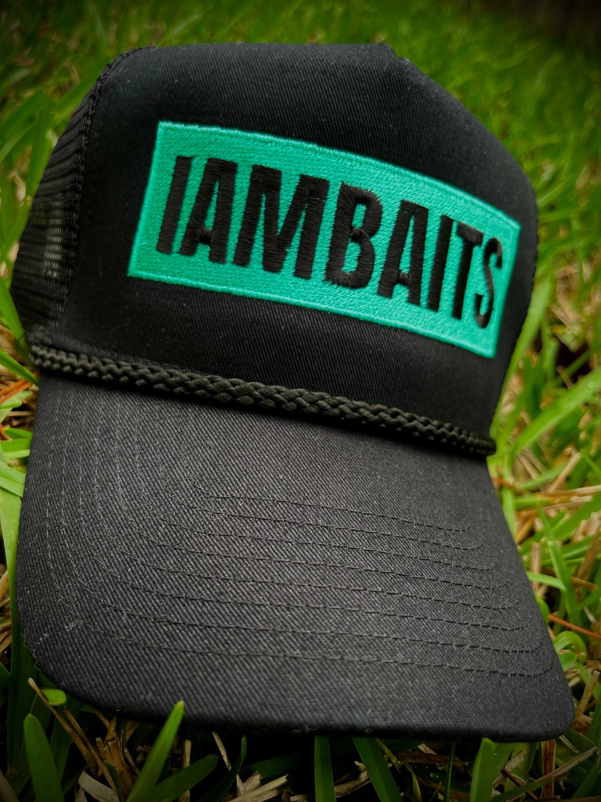 IAMBAITS: Teal and black trucker hat